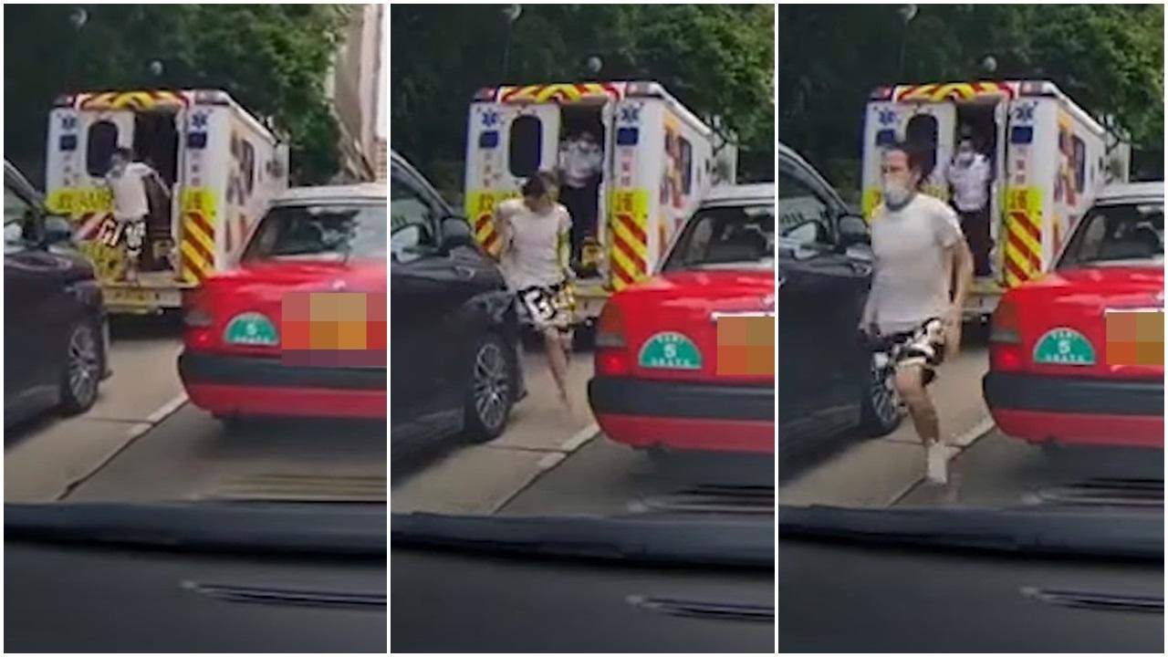 一名腳部包紮的男子打開救護車門狂奔,兩名救護員落車追截。(網片截圖)